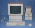 A complete system consisting of the system unit, colour display, two 3.5" floppy drives, two 5.25" drives, matching keyboard and mouse. - iigs-01.jpg